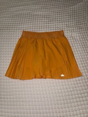 ALO Yoga Women's Orange Pleated Skort with Built-In Shorts